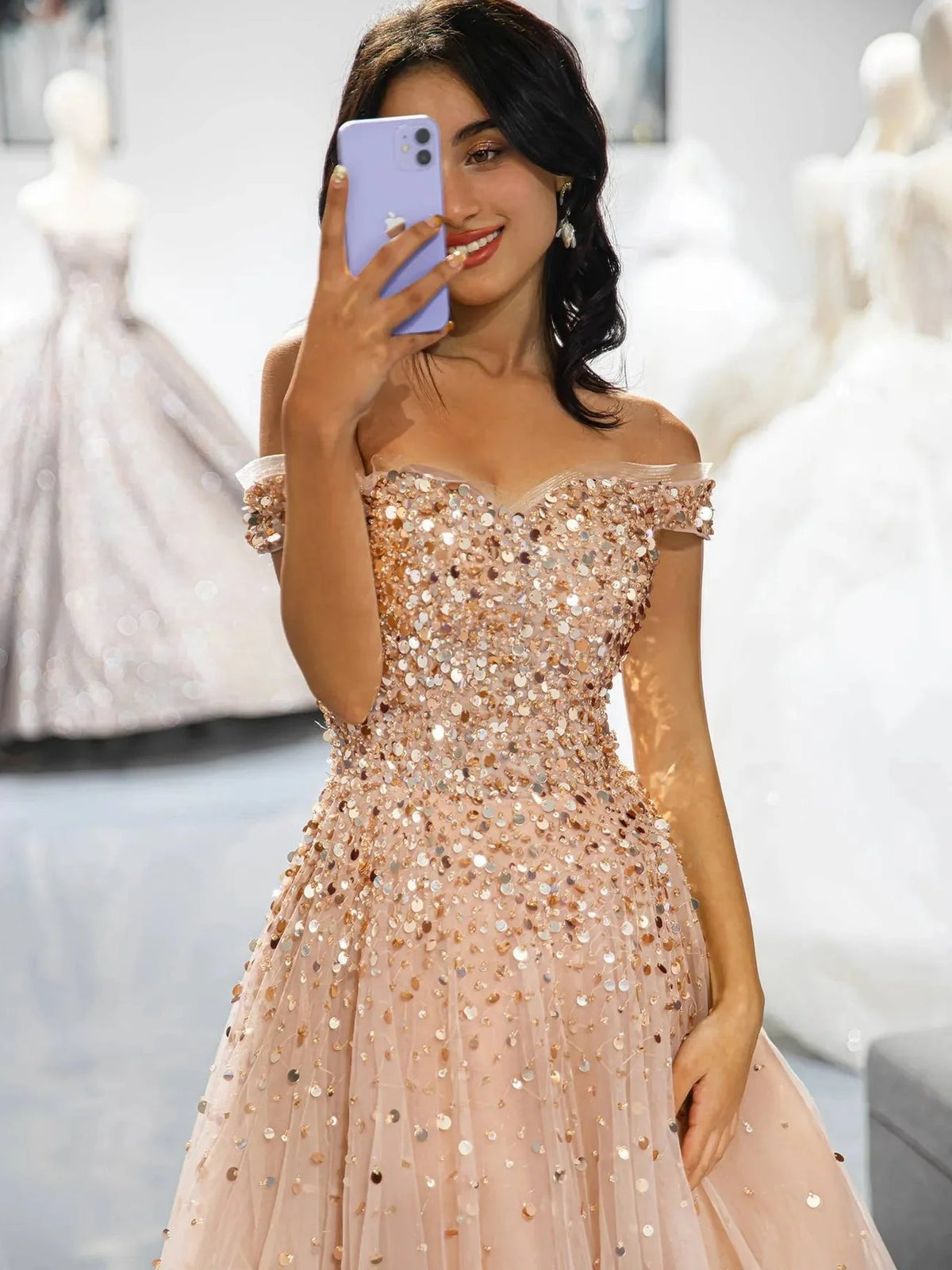 Champagne sequined off-shoulder corset dress with ruffled neckline and tulle skirt