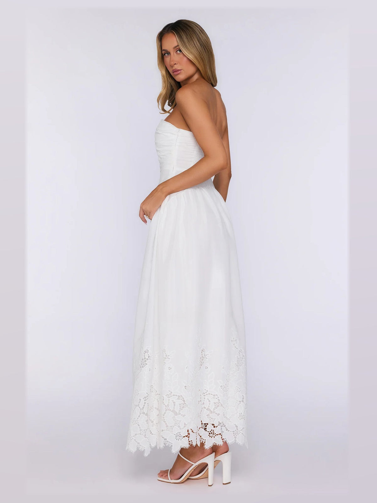 White formal dress with structured woven fabric construction and maxi hem