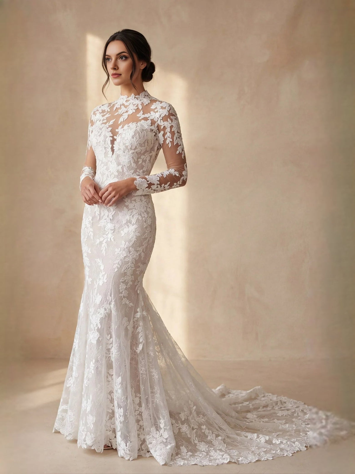Ivory fitted mermaid wedding dress with high neck illusion lace and long sheer sleeves.