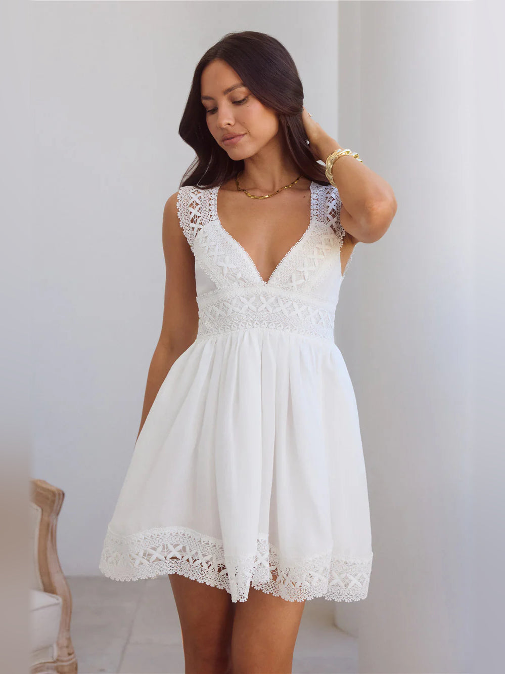 White lace V-neck cap-sleeve A-line mini dress with lace-trim skirt hem