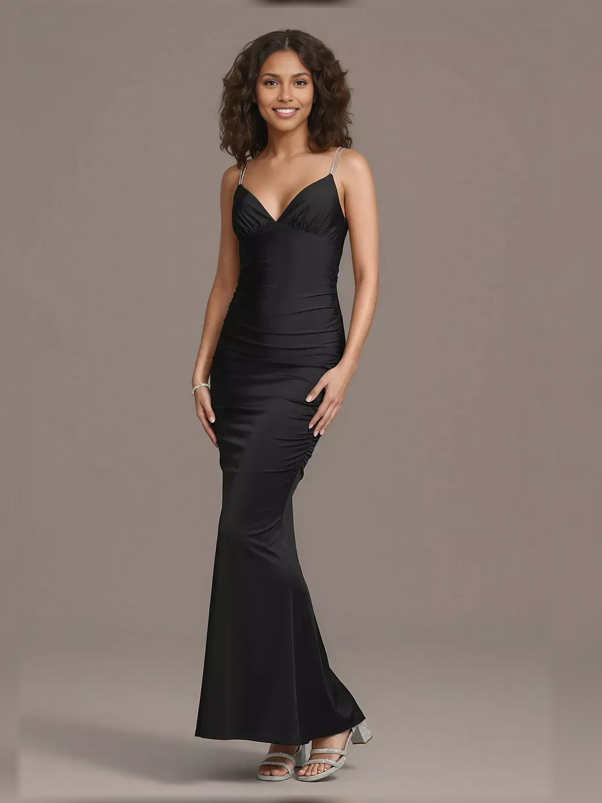 Black ruched corset mermaid dress with spaghetti straps, V-neckline, floor-length hem.