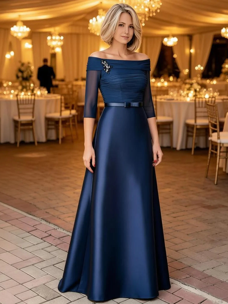 Blue satin A-line off-shoulder gown with ruched bodice, waist belt, and floor length