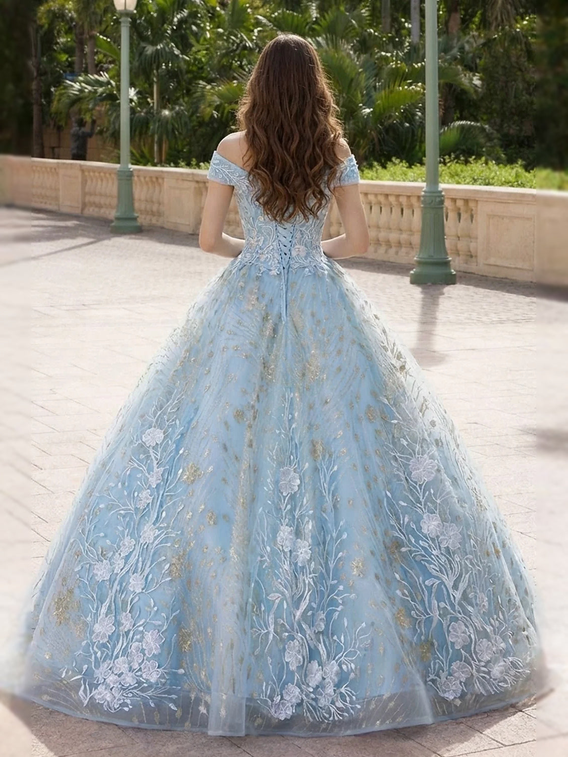 Back view sky blue off-shoulder embroidered tulle ball gown with full, flared skirt