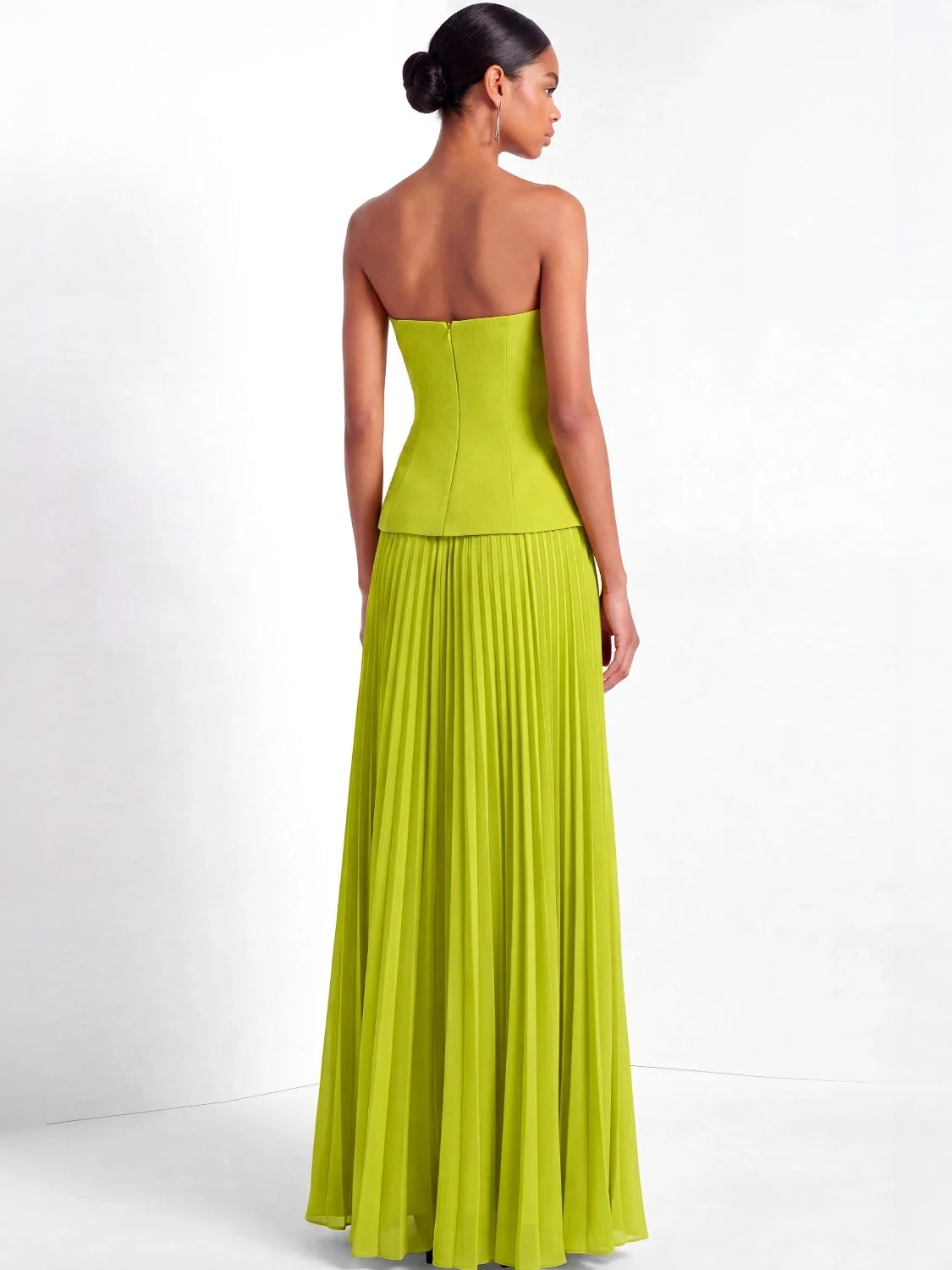 Lime green strapless maxi gown with pleated skirt, shown from the back