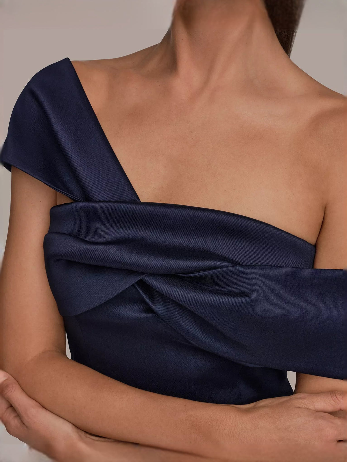 Navy satin one-shoulder bodice with twisted fabric knot detail