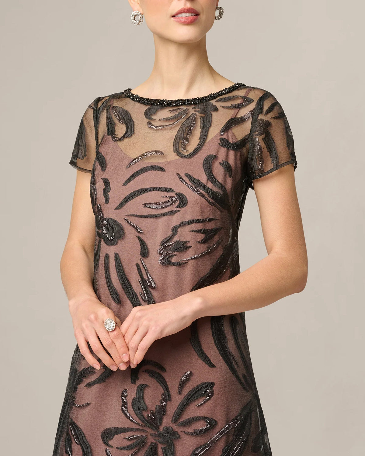 Black sheer maxi dress with short sleeves, round neckline, floral embroidery detail