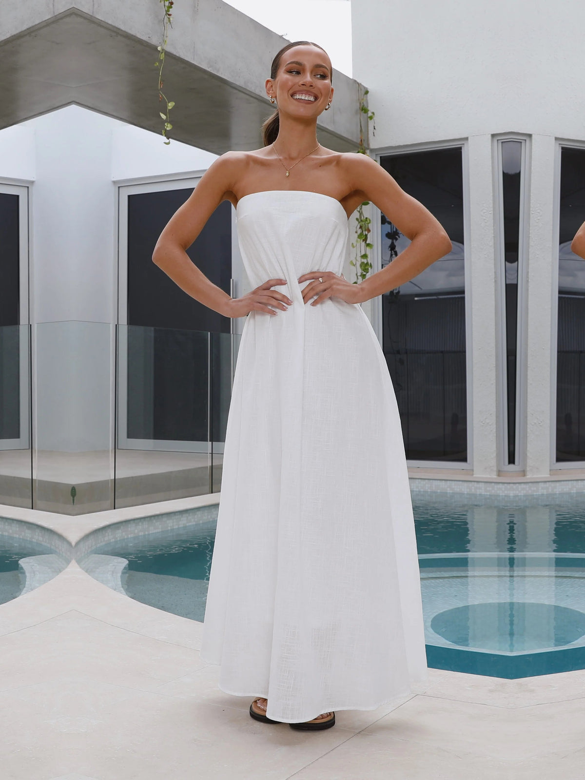 White a-line maxi formal dress with strapless neckline, alternate view showing the bodice