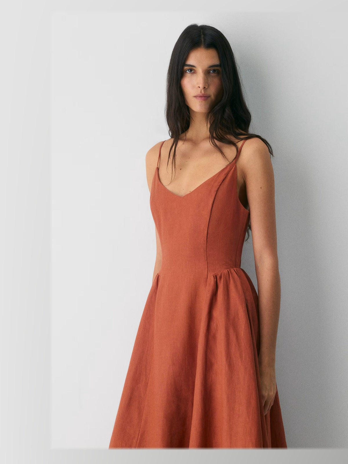 Terracotta formal dress with structured woven fabric construction and maxi hem