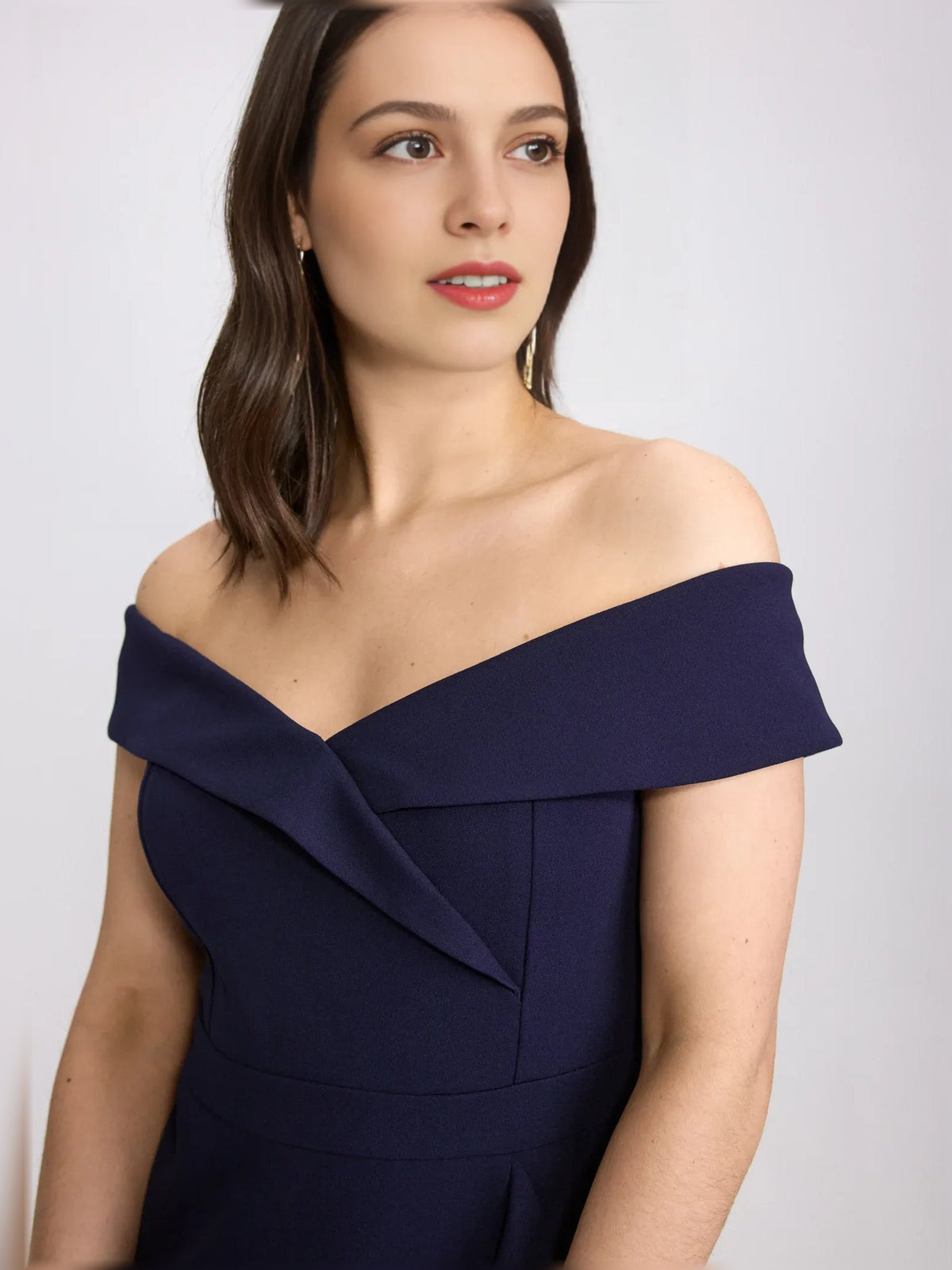 Off-shoulder neckline ruffle detail on dark navy midi formal dress, short sleeves