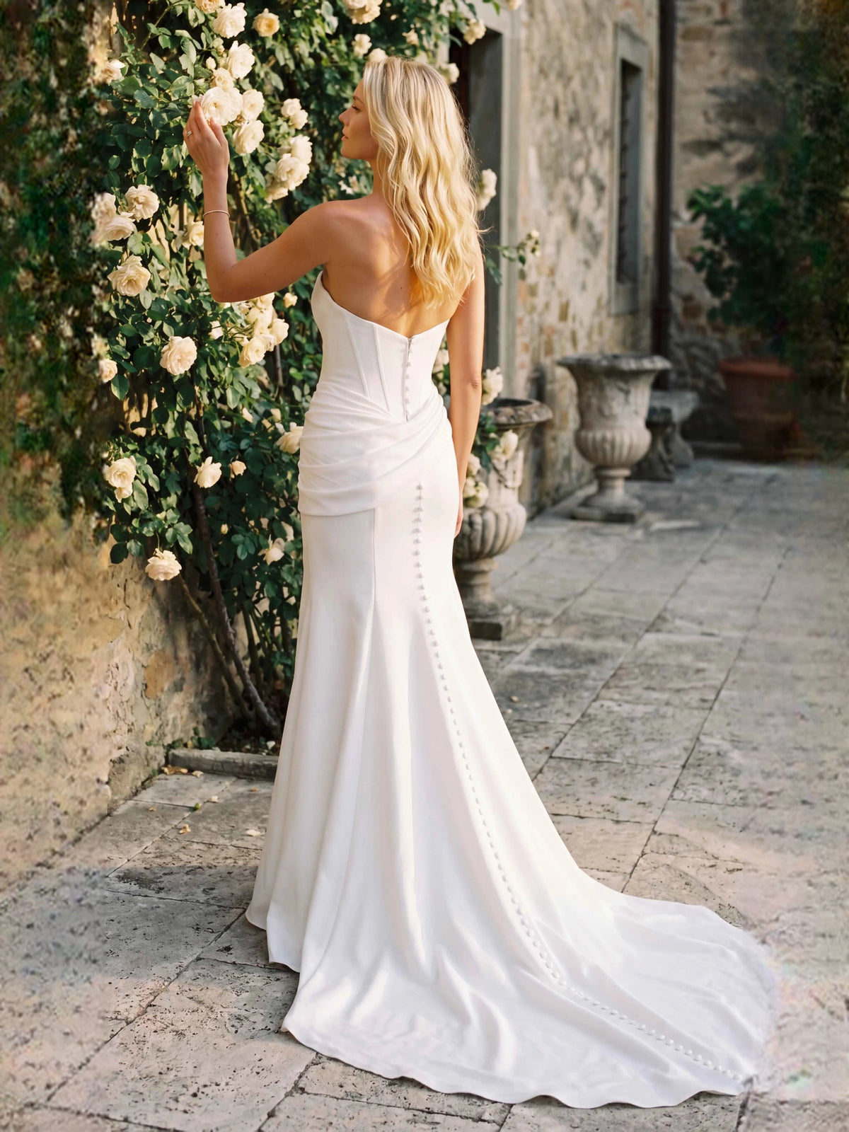 Ivory satin sweetheart mermaid wedding dress with corset seams and long train
