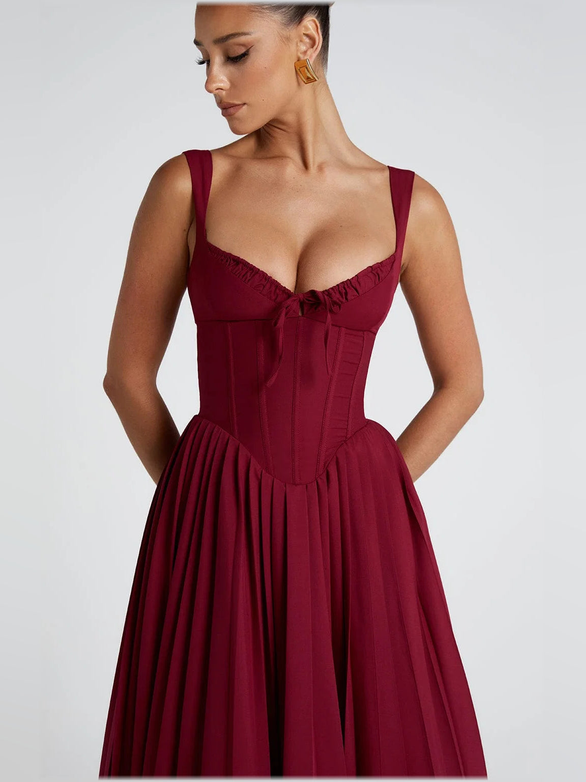 Berry midi formal dress bodice with sweetheart neckline, ruched seams, and bow detail