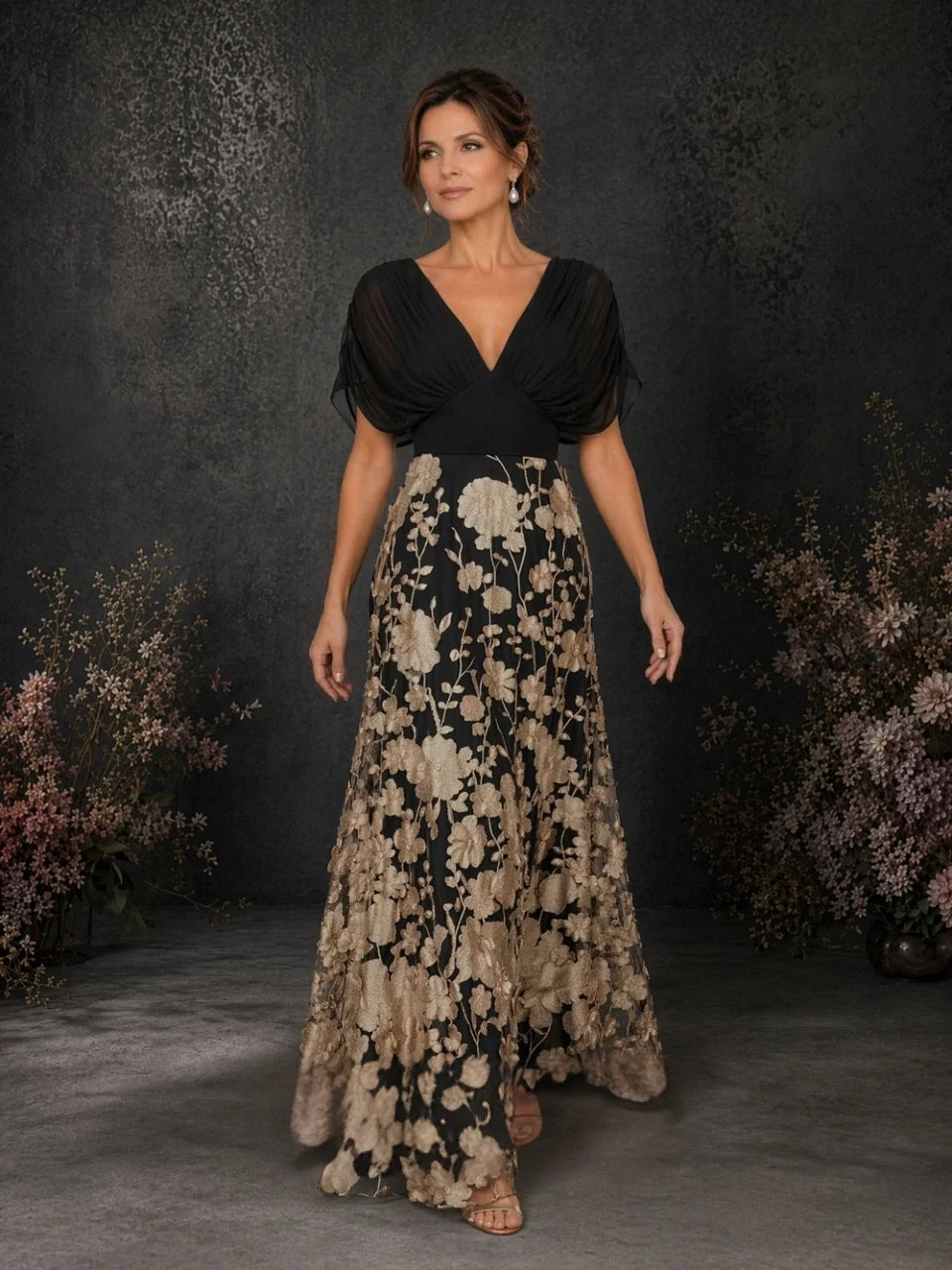 Black V-neck draped A-line floor-length floral embroidered dress, front 3/4 view