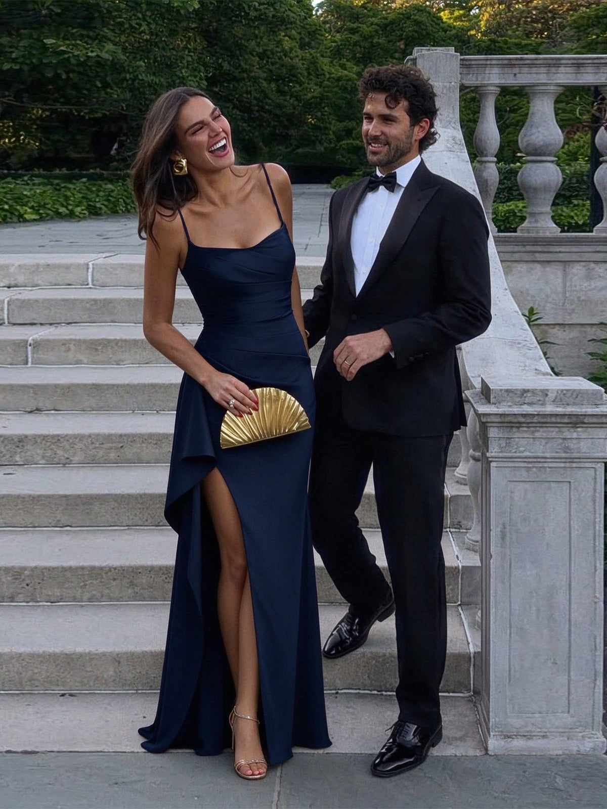 Navy cowl-neck draped formal gown with high slit and slim spaghetti straps