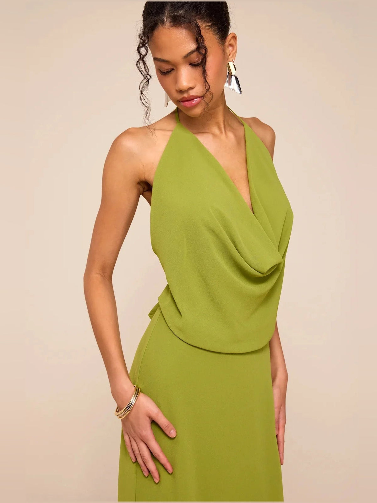 Olive green halter cowl maxi dress with draped neckline and open-look front detail