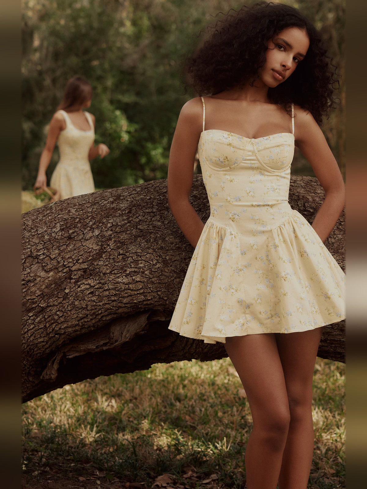 Floral corset mini dress with spaghetti straps and flared hem, side view