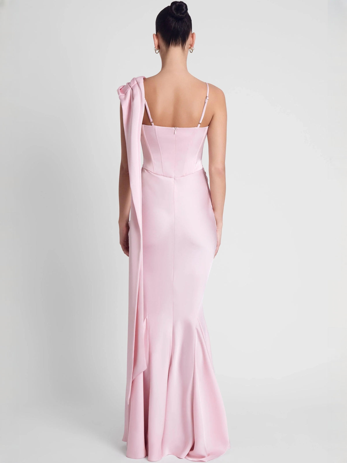 Back view of pink mermaid floor-length dress with thin straps and draped neckline