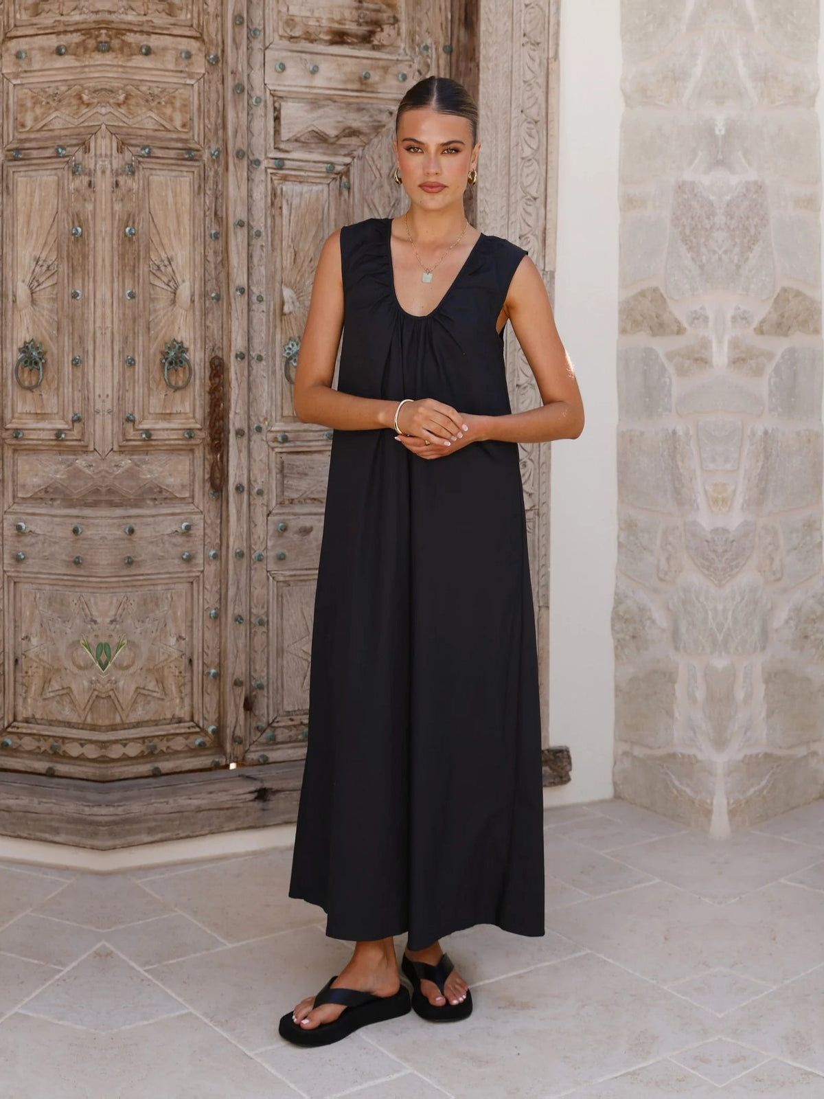 Black a-line maxi formal dress with halter neckline, alternate view