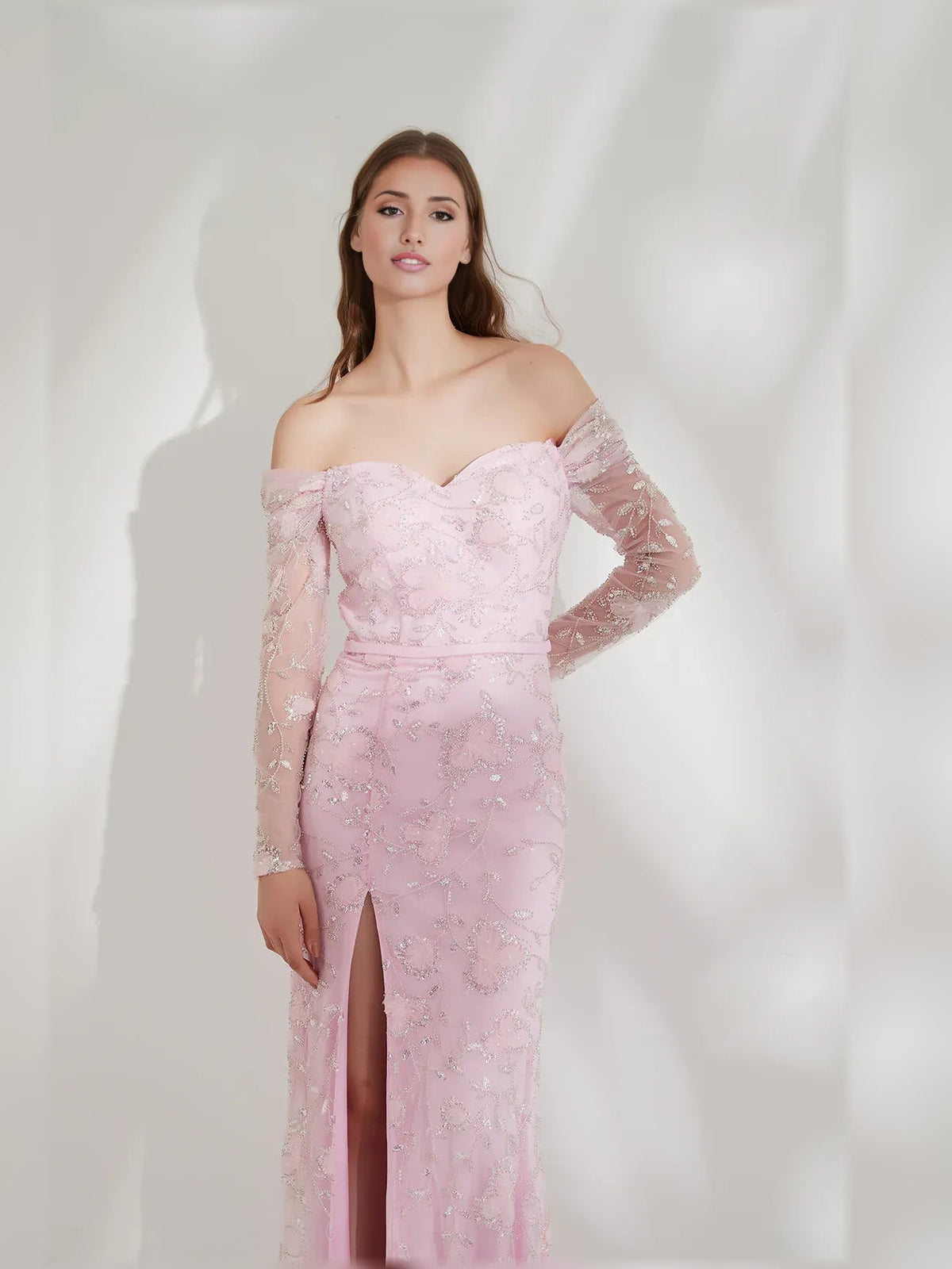 Blush pink floral off-shoulder long-sleeve formal dress with fitted bodice and leg slit
