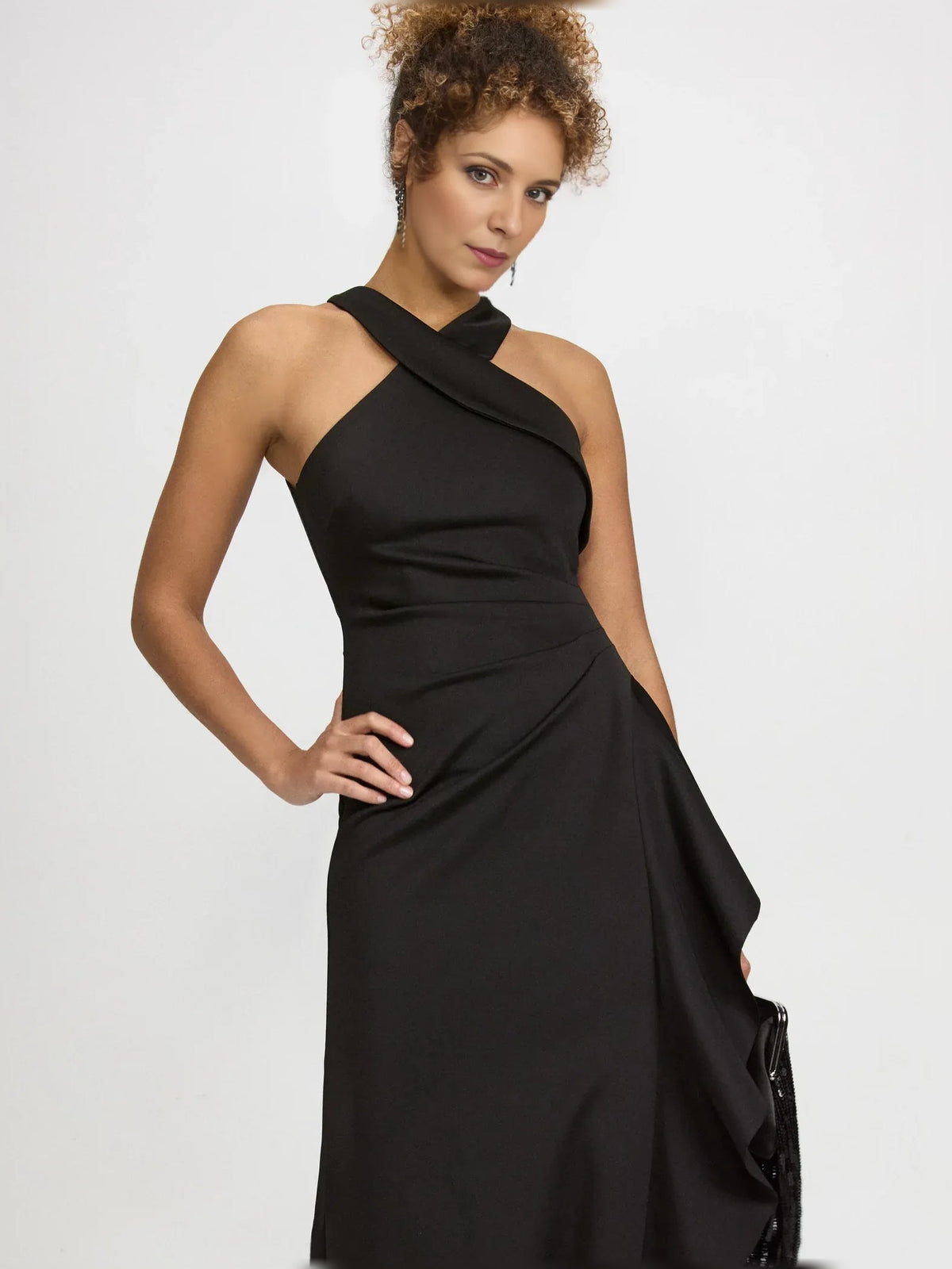 Black halter-neck formal dress with wrap-style drape and side slit, floor length