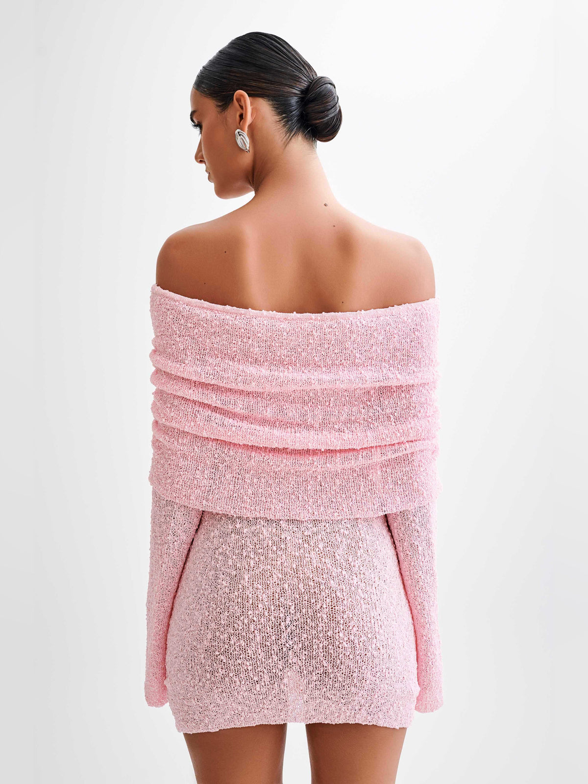 Baby pink off-shoulder mini dress with open back and layered ruffled sleeves