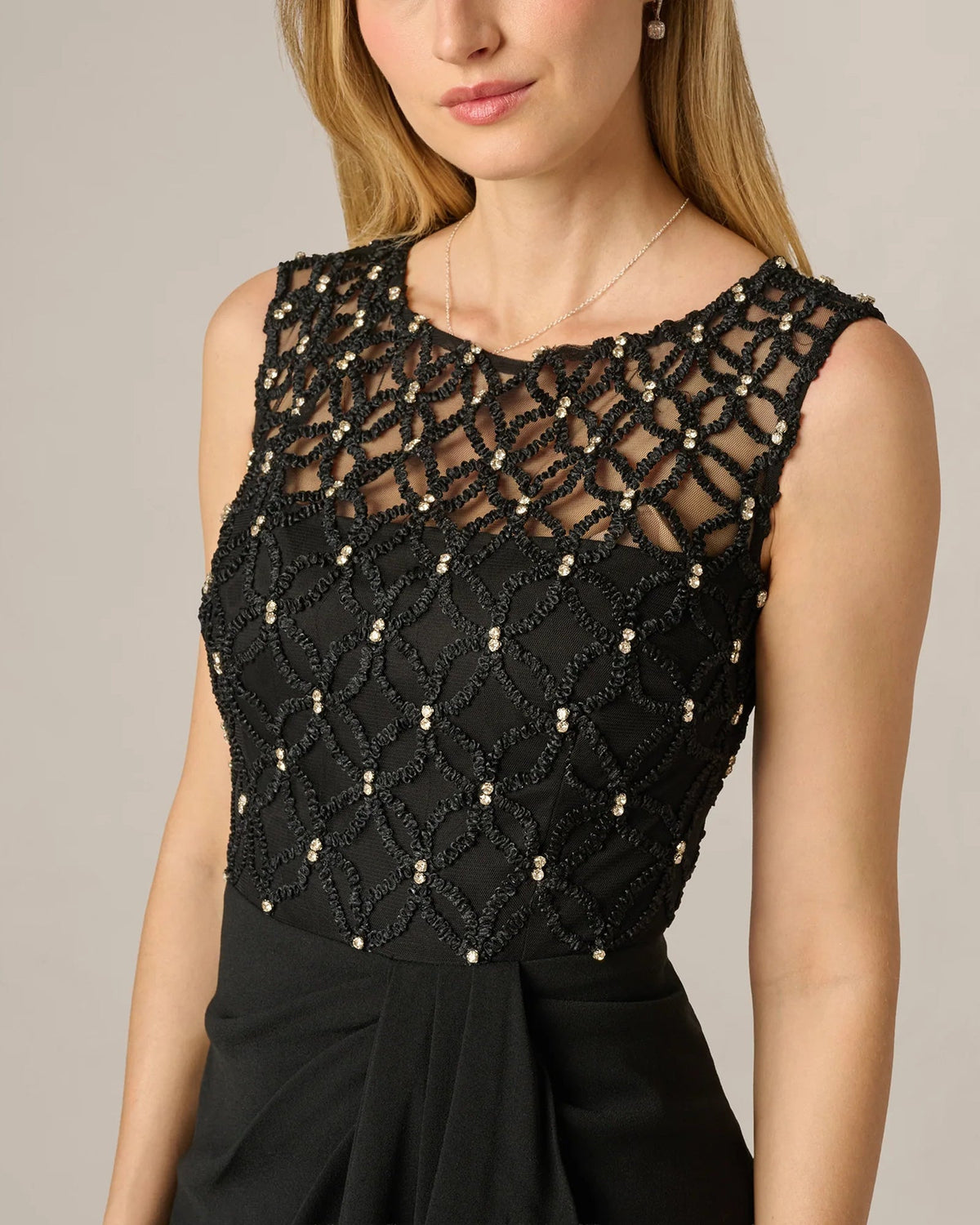 Black lace bodice with gold bead embellishments and scalloped neckline
