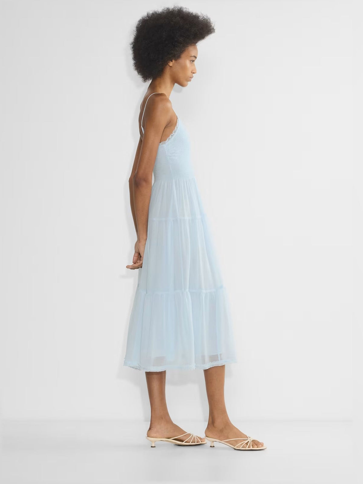 Light blue chiffon midi dress with spaghetti straps and tiered ruffle layers