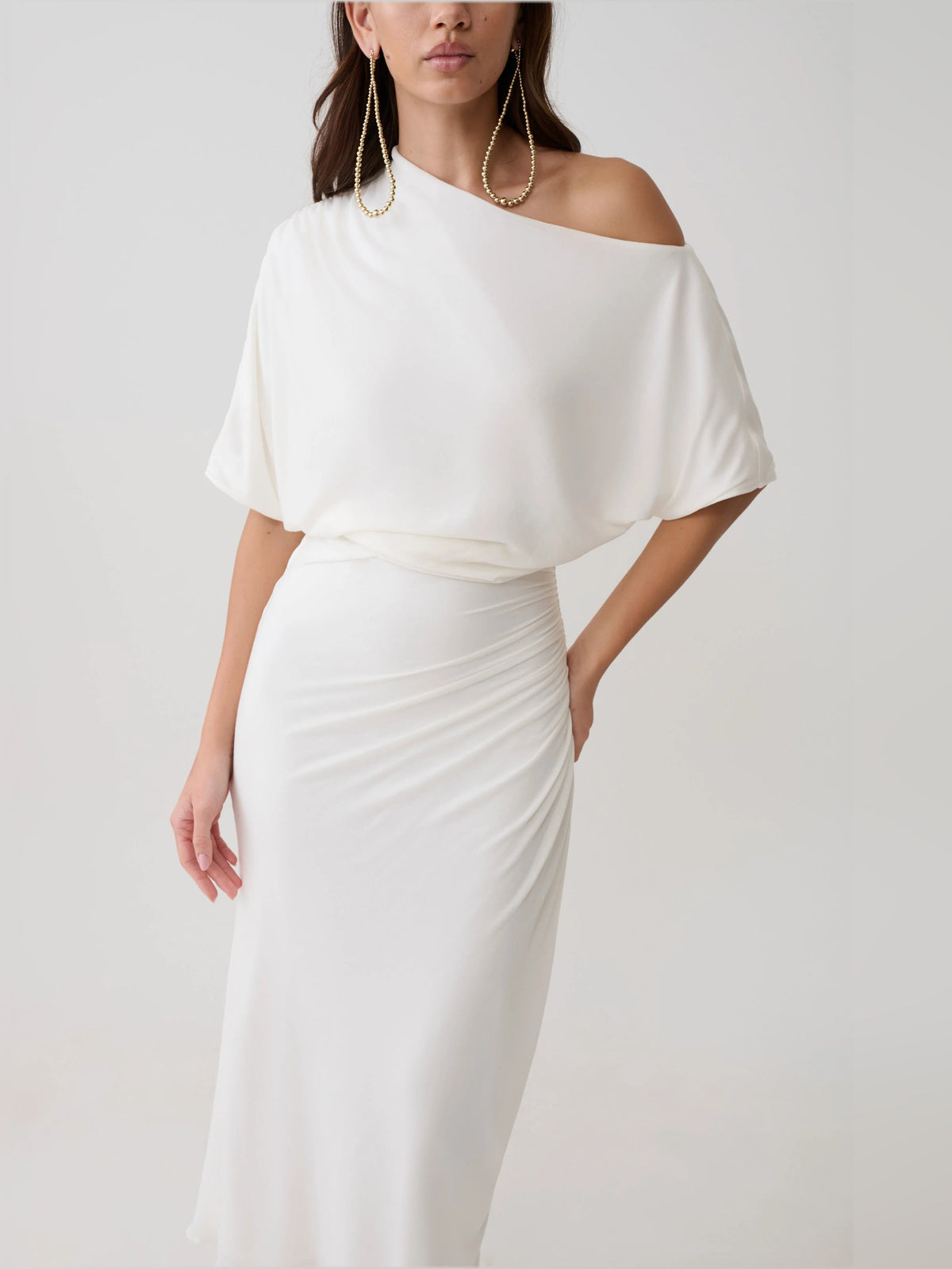 White one-shoulder midi dress with draped neckline and ruched waist