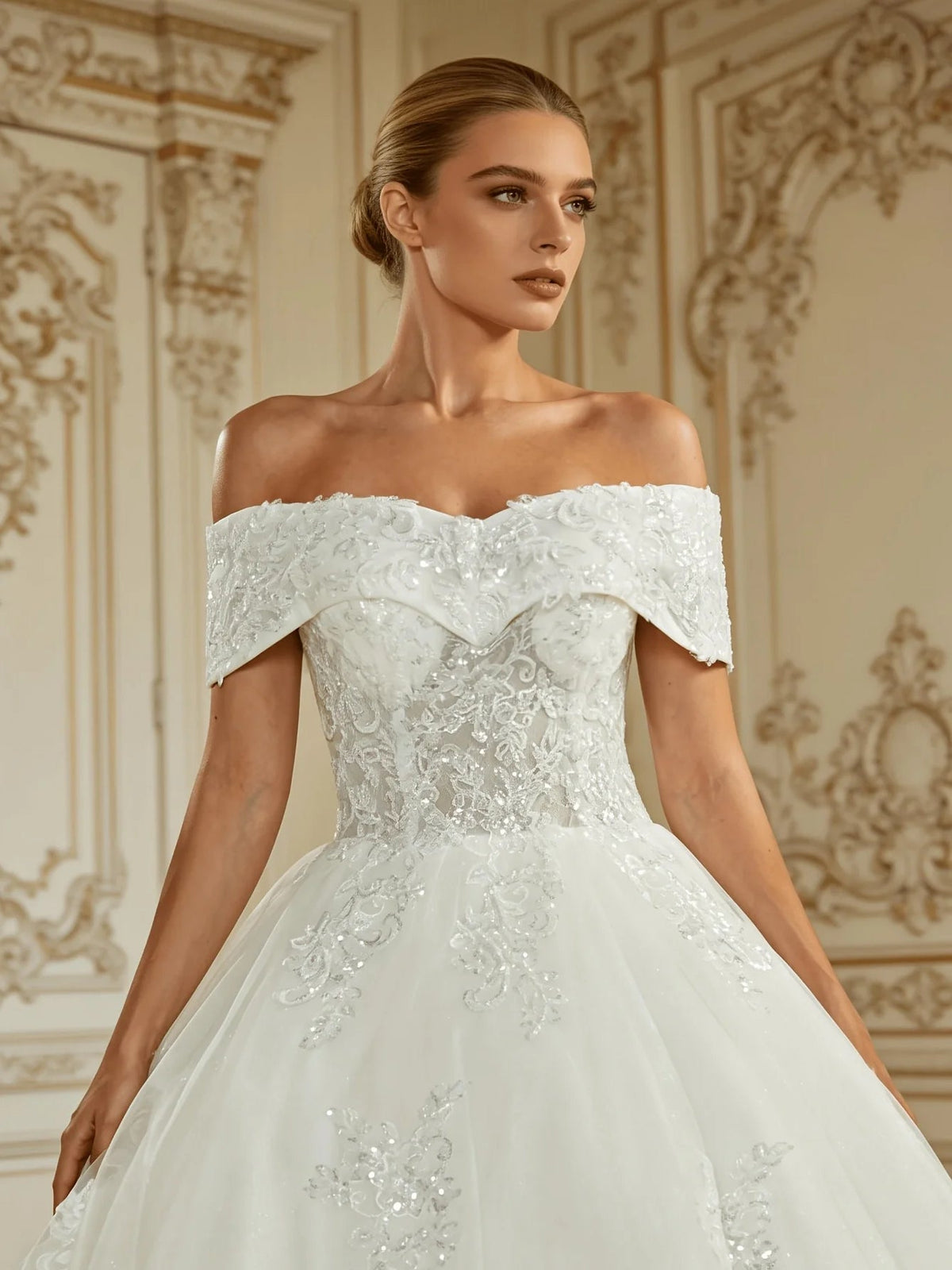 Ivory off-shoulder corset-style wedding bodice with floral lace and tulle skirt