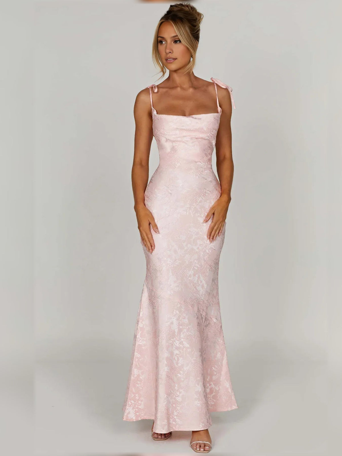 Blush pink floral formal dress with square neckline, spaghetti straps, fitted to flared hem