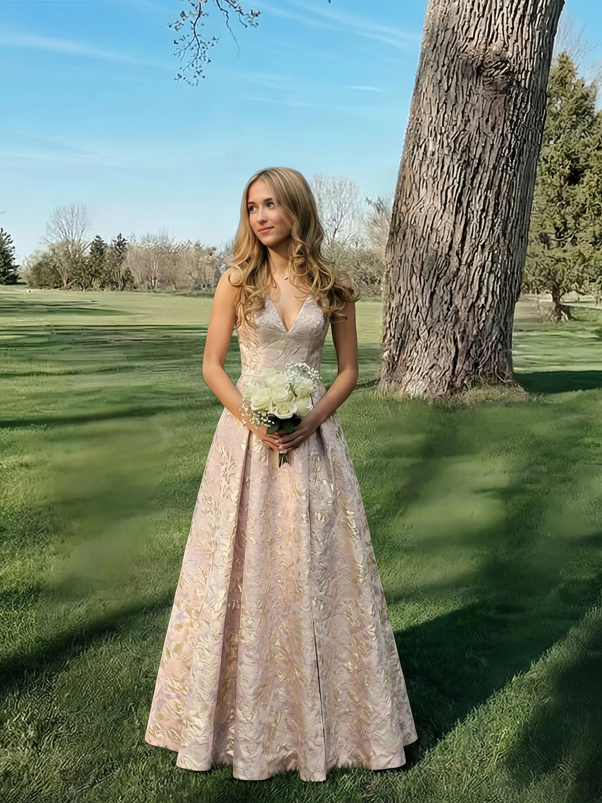 Pink floral V-neck A-line prom dress with sleeveless bodice and pleated floor length