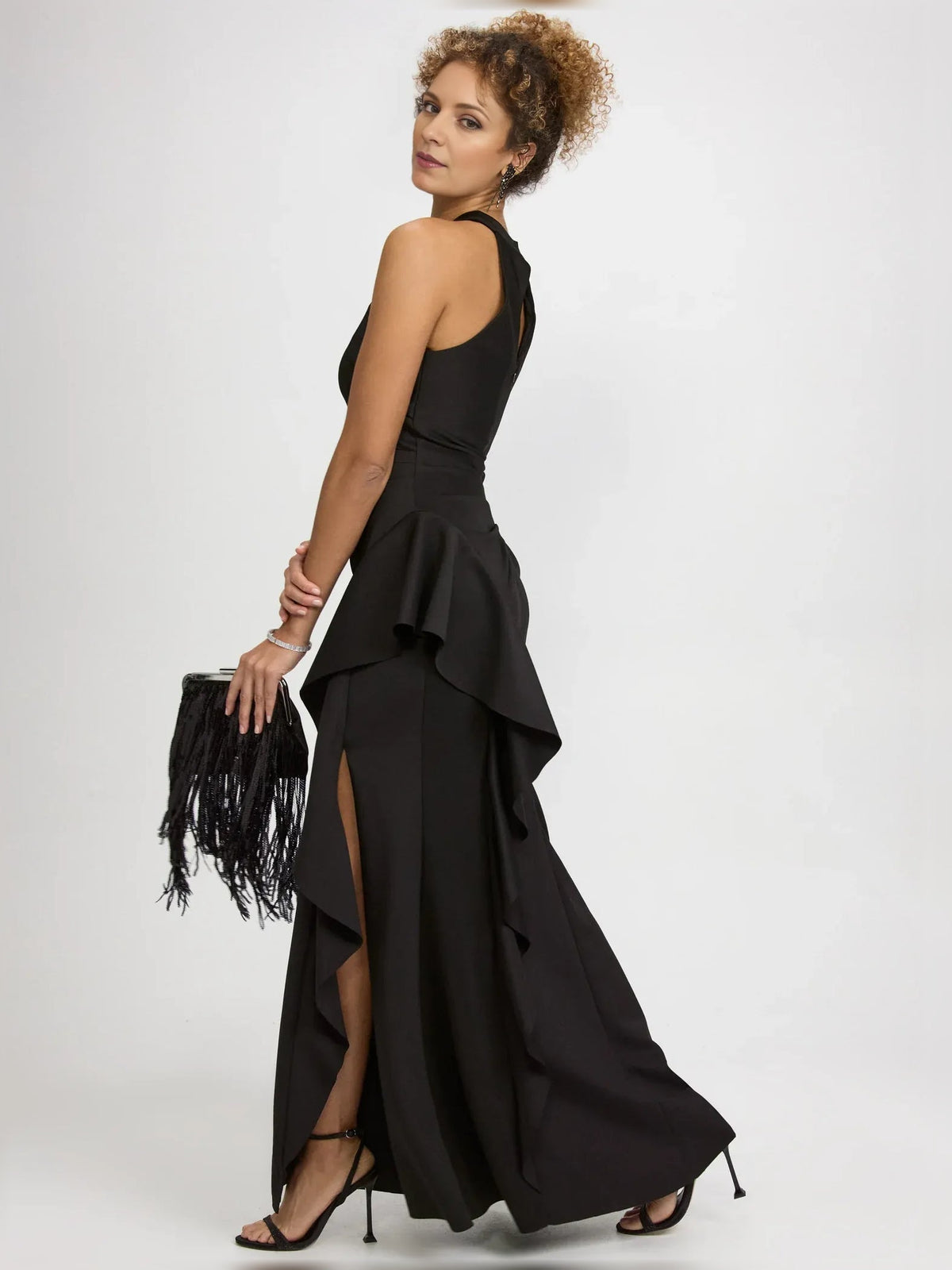 Black halter-neck formal dress with layered ruffle skirt and thigh-high slit, long