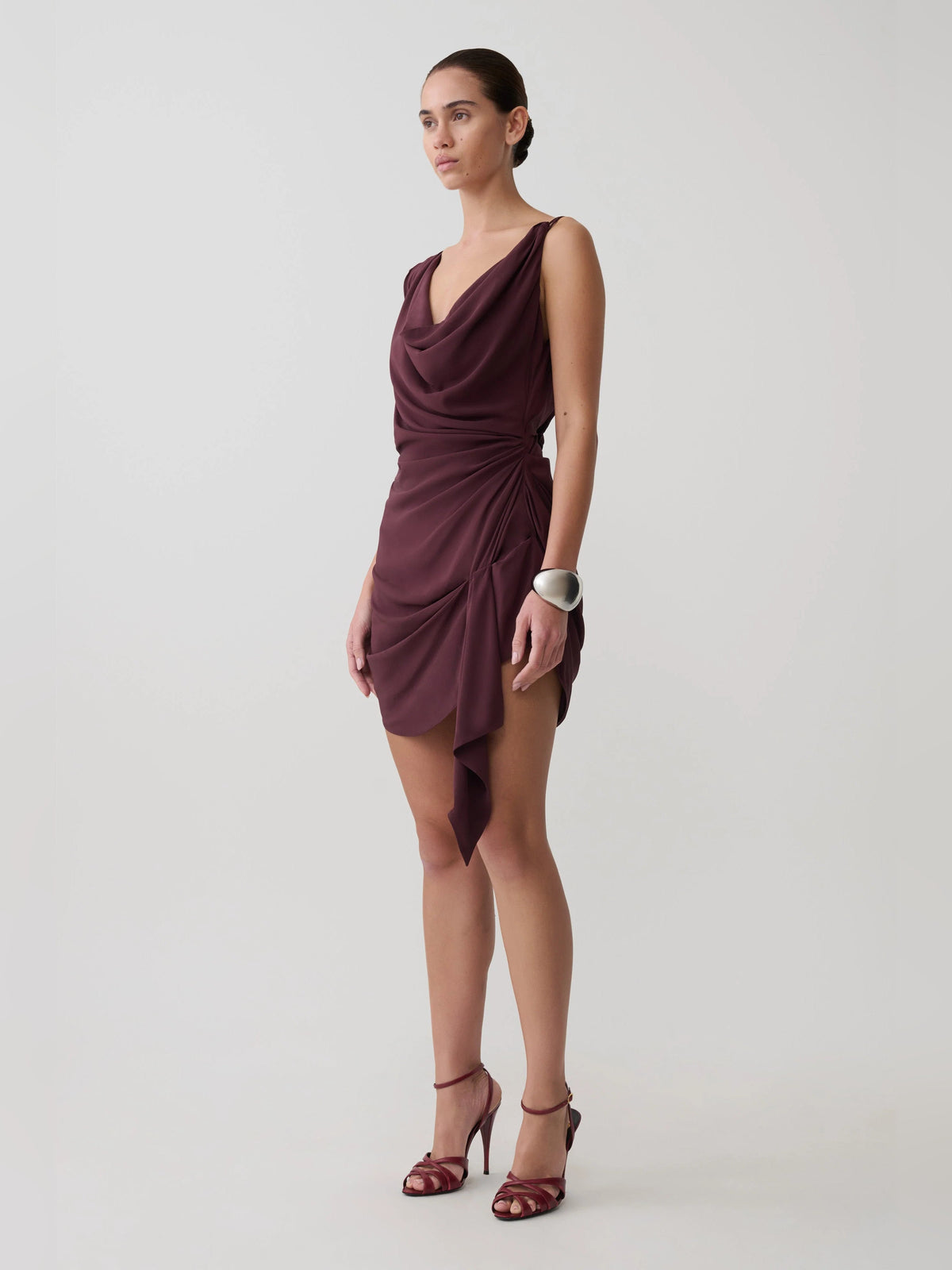 Plum satin mini dress with draped cowl neck and asymmetric wrap hem