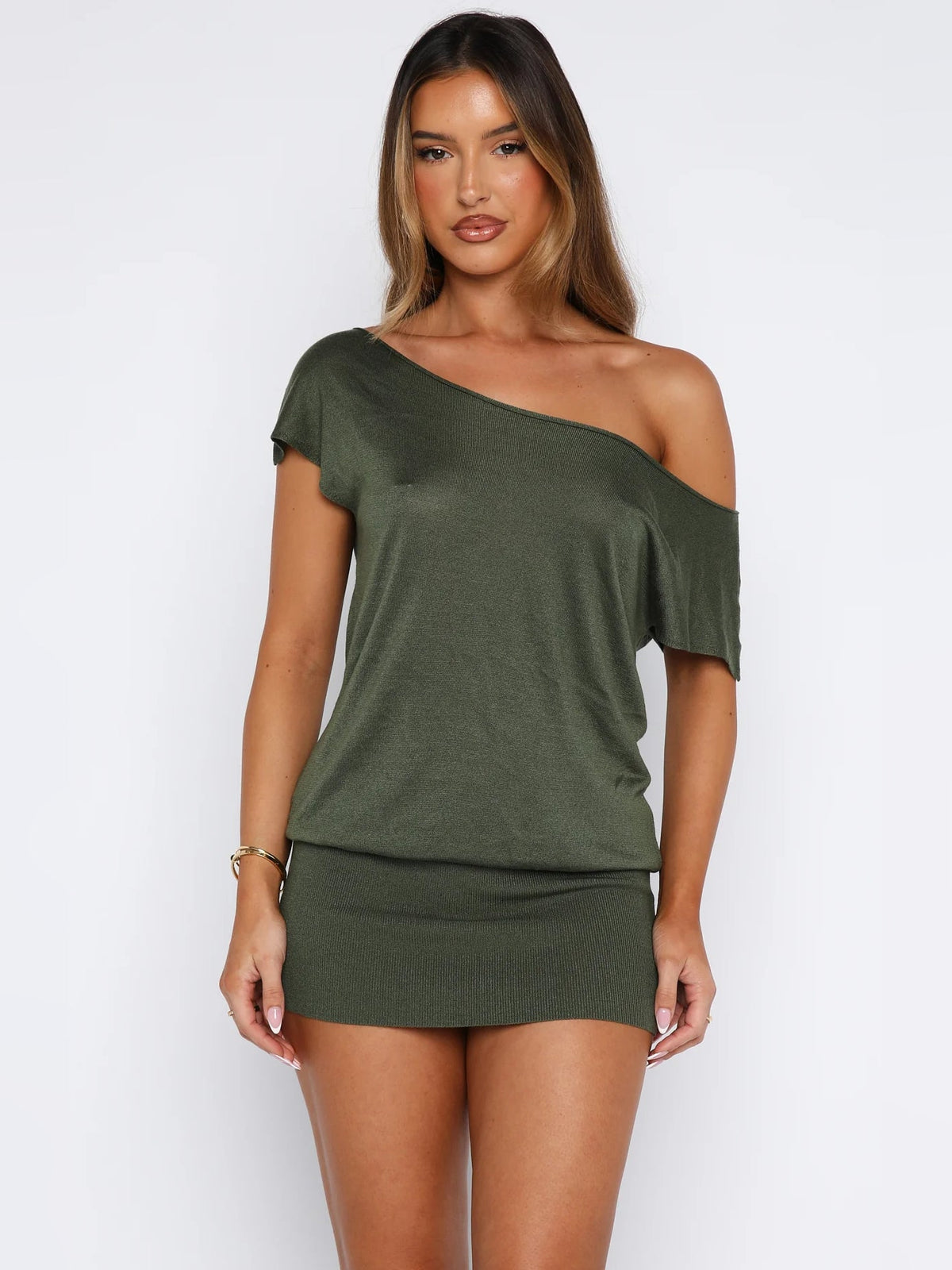 Olive off-shoulder mini dress with slanted neckline, short sleeves, and draped detail