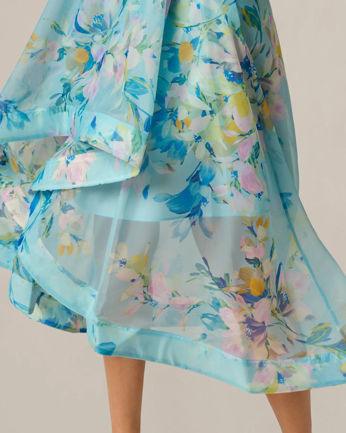 Blue floral midi skirt with layered ruffles and flowing A-line silhouette