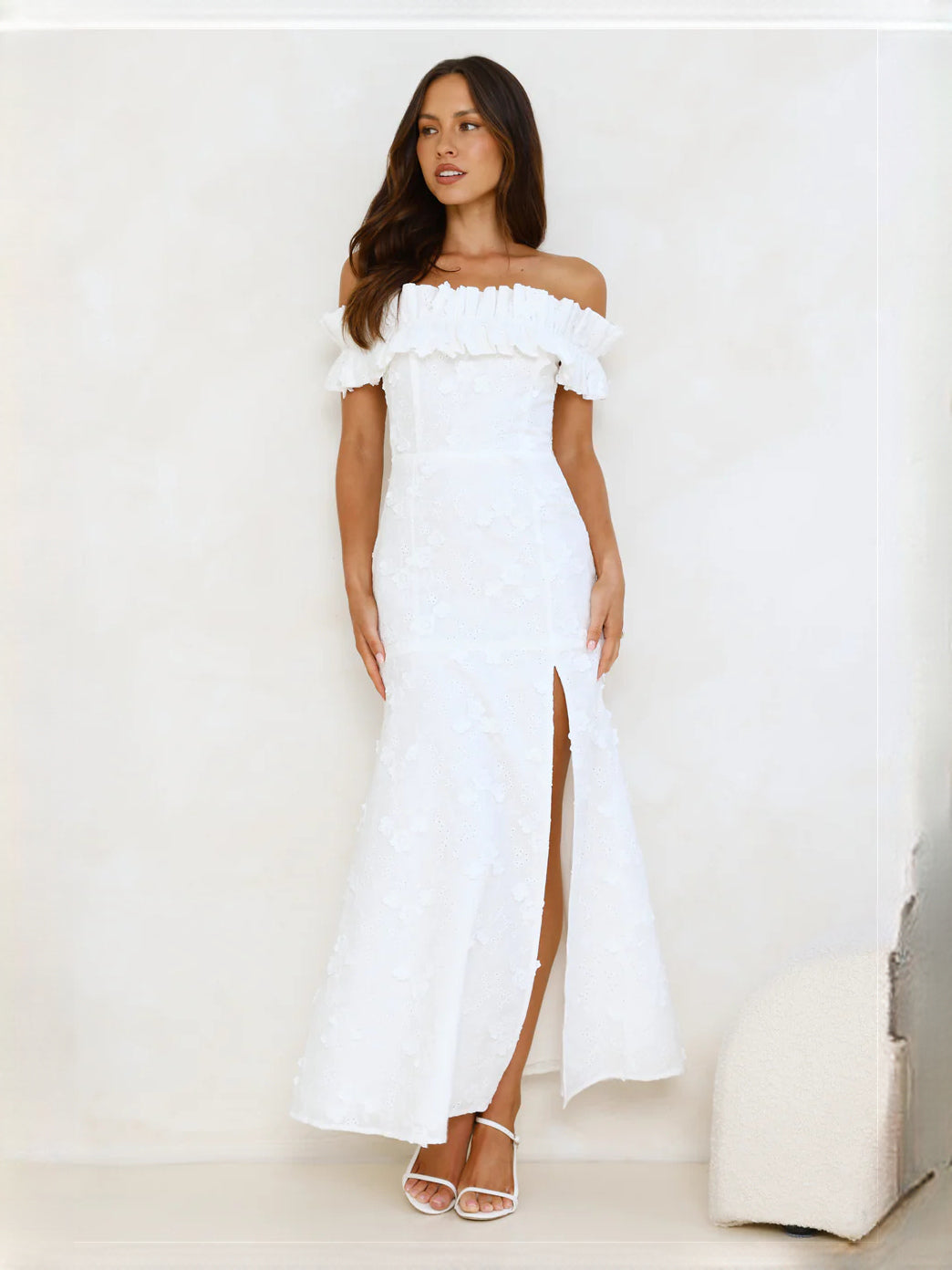 White off-the-shoulder ruffle maxi dress with fitted bodice and front slit