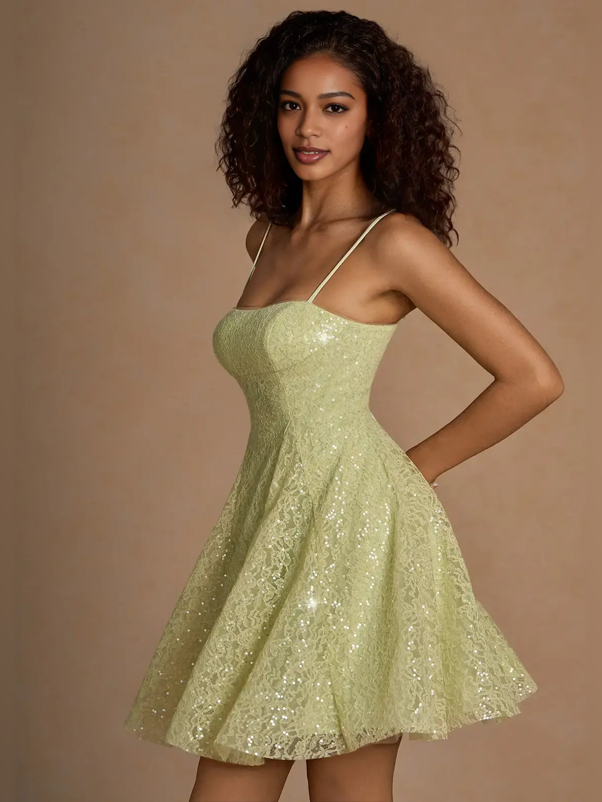 Sage green sequin mini A-line dress with thin straps and flared skirt