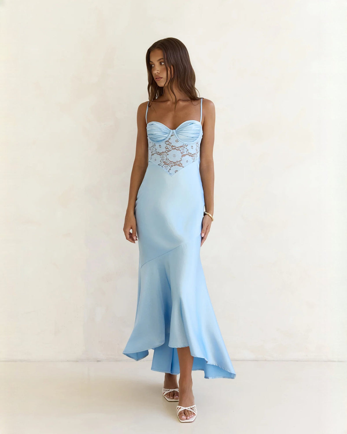 Light blue sleeveless A-line maxi dress with lace bodice and flowing asymmetrical hem