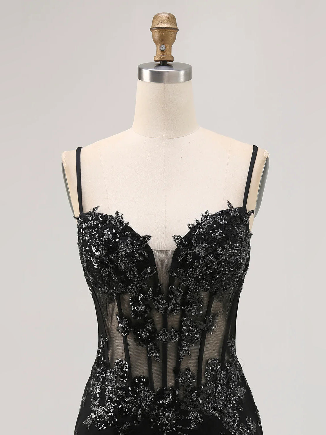 Black sequin corset mini dress on mannequin, sweetheart neckline and spaghetti straps