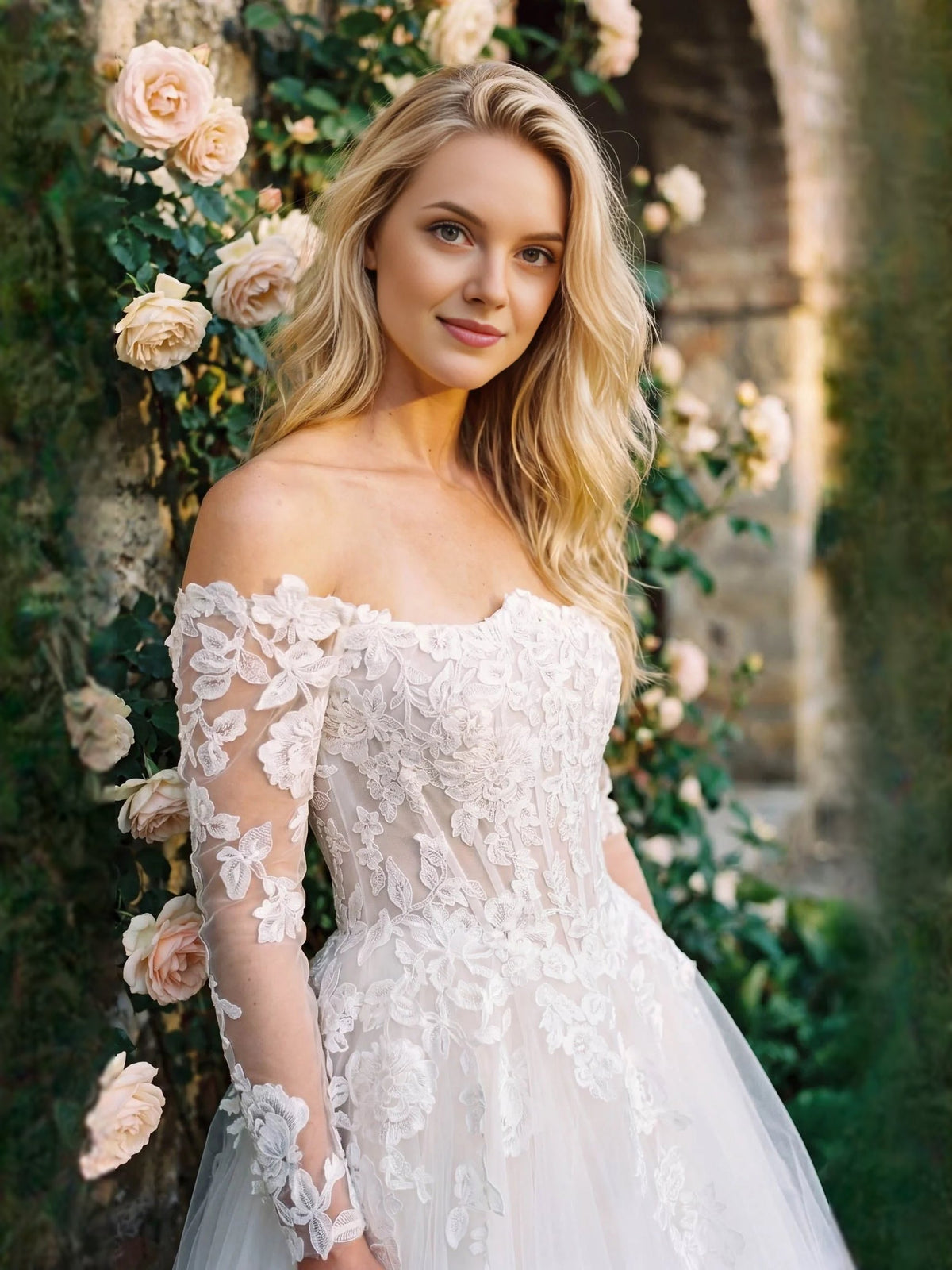 Ivory off-shoulder lace wedding dress with corset bodice, long sleeves, and tulle skirt