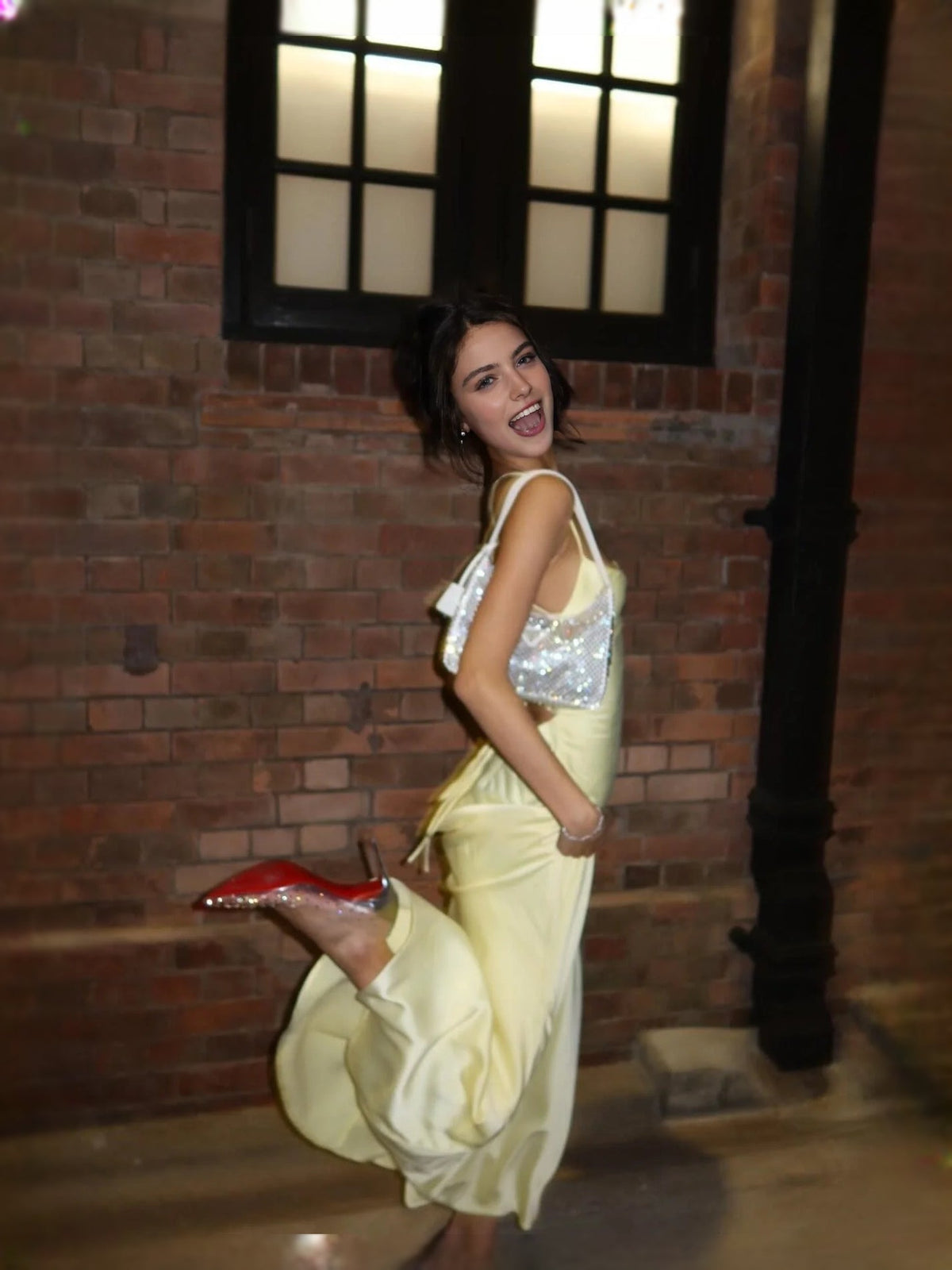 Pale lemon satin sleeveless mermaid prom dress with back drape and crisscross straps