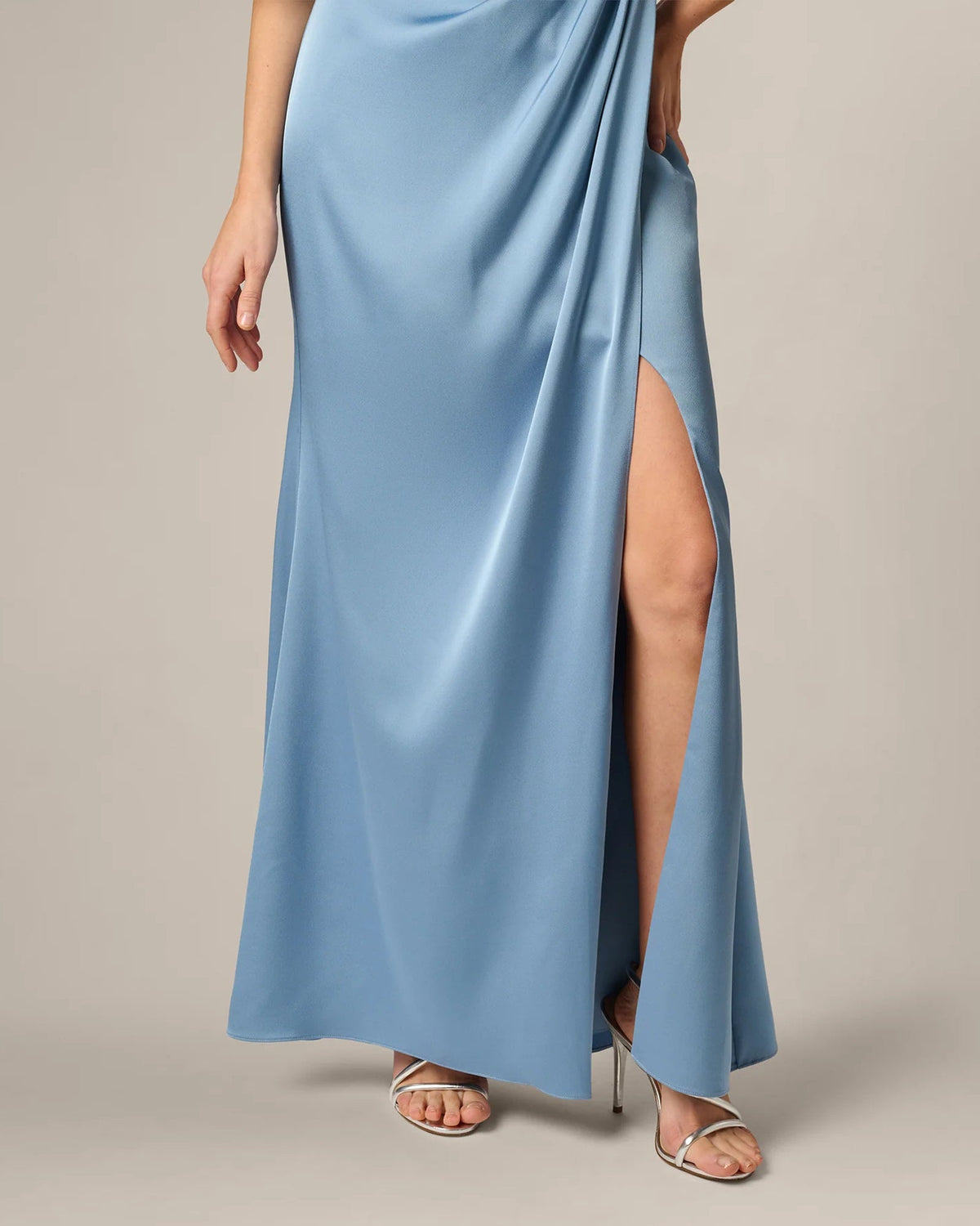 Light blue satin-like maxi dress with side slit and draped one-shoulder bodice