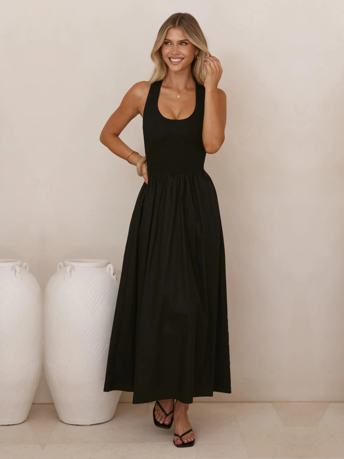 Black a-line maxi formal dress with halter neckline, alternate view showing the waist