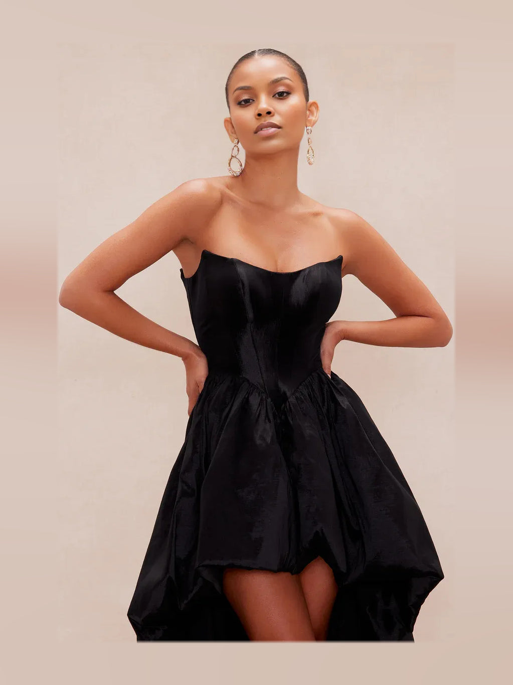 Black strapless corset prom dress with draped bodice and asymmetrical high-low hem
