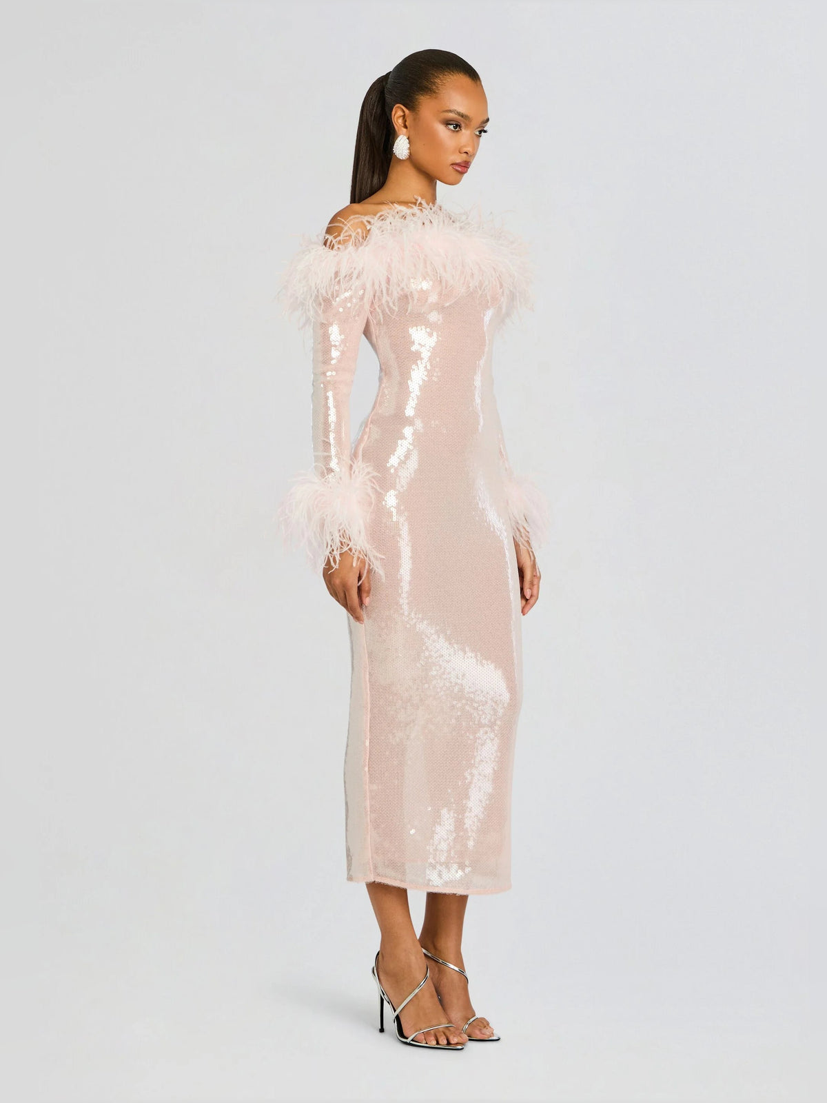 Pink sequin midi dress with feathered neckline and long sleeves, full length
