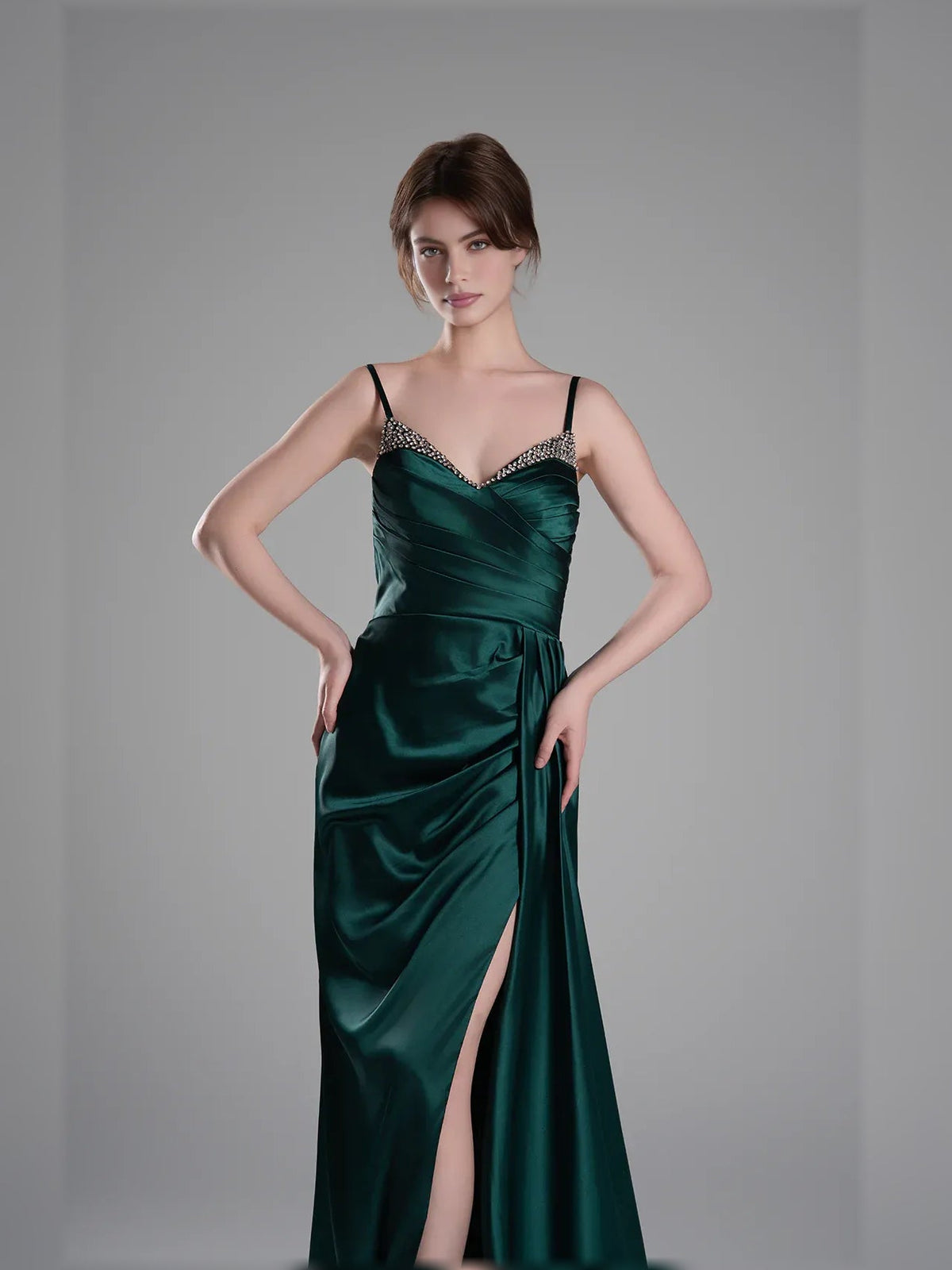 Peacock green satin V-neck evening dress with ruching at bodice and high slit.