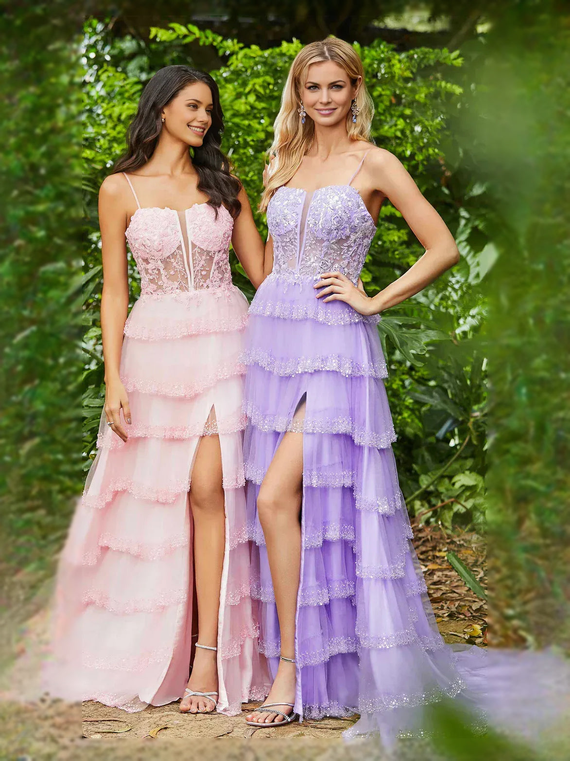 Two sweetheart corset tiered prom dresses, blush and lilac, with front slits