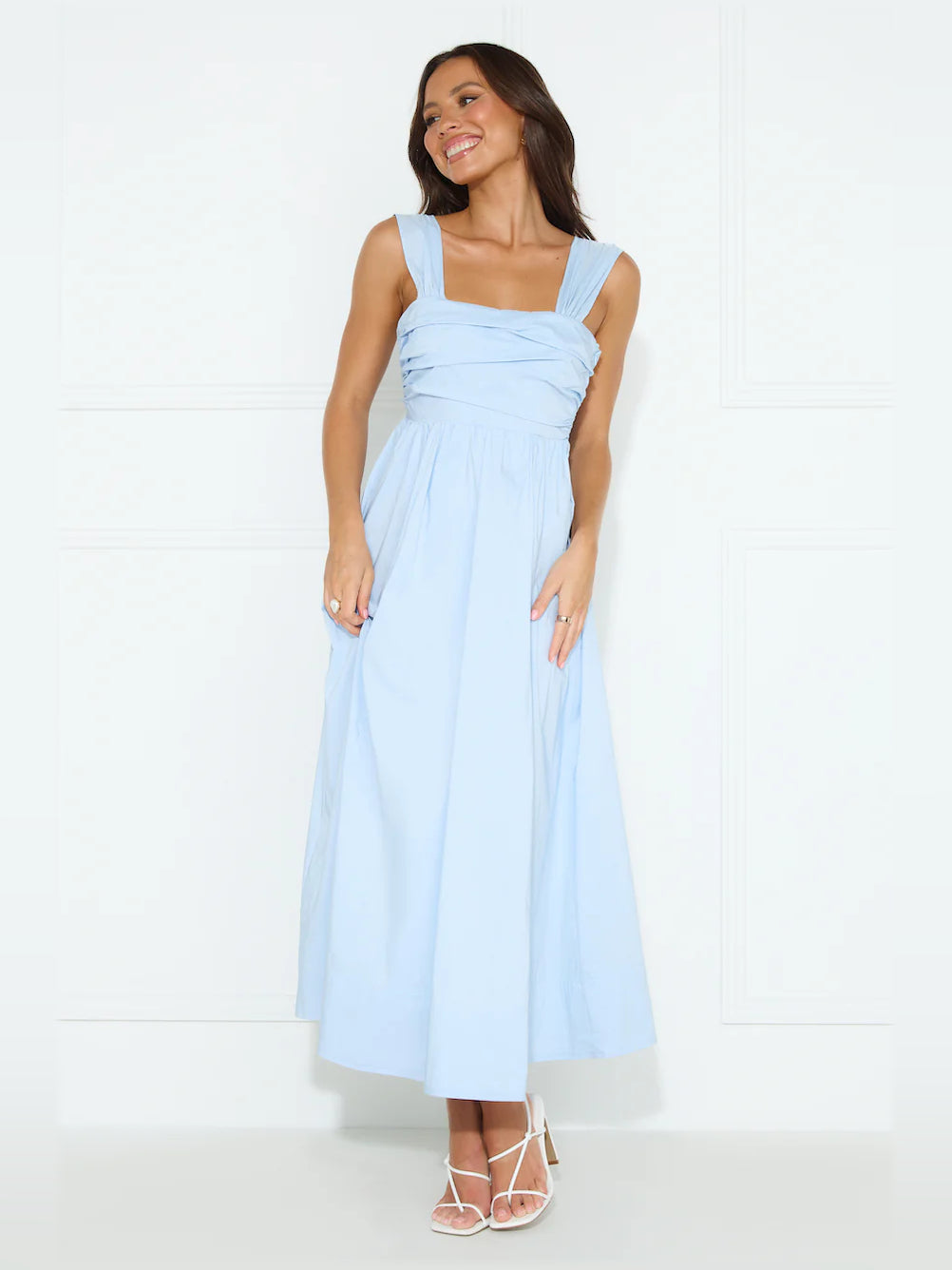 Light blue sleeveless midi dress with square neckline and gathered, pleated bodice