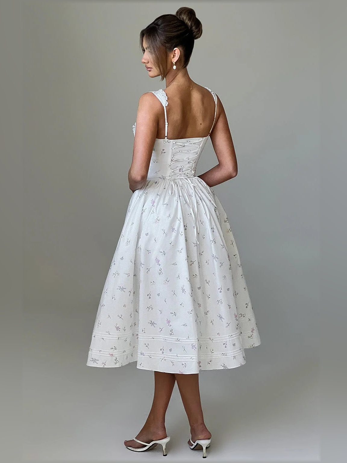 White midi formal dress from the back, lace-trim straps, gathered waist, full skirt with print