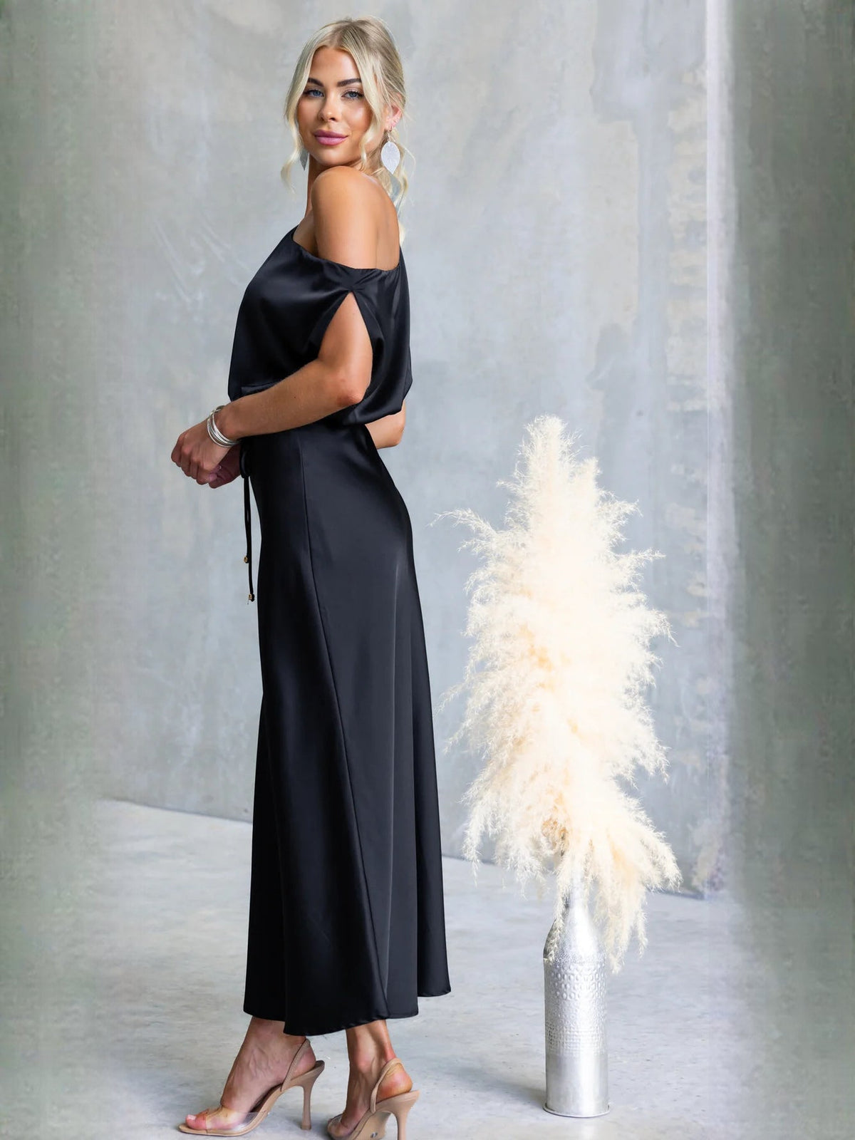 Black sheath maxi formal dress with draping, alternate full-length view showing the waist