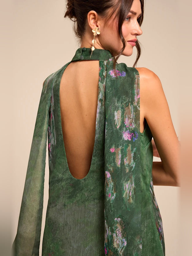 Green floral sleeveless mini dress with high neckline and open U-back cutout